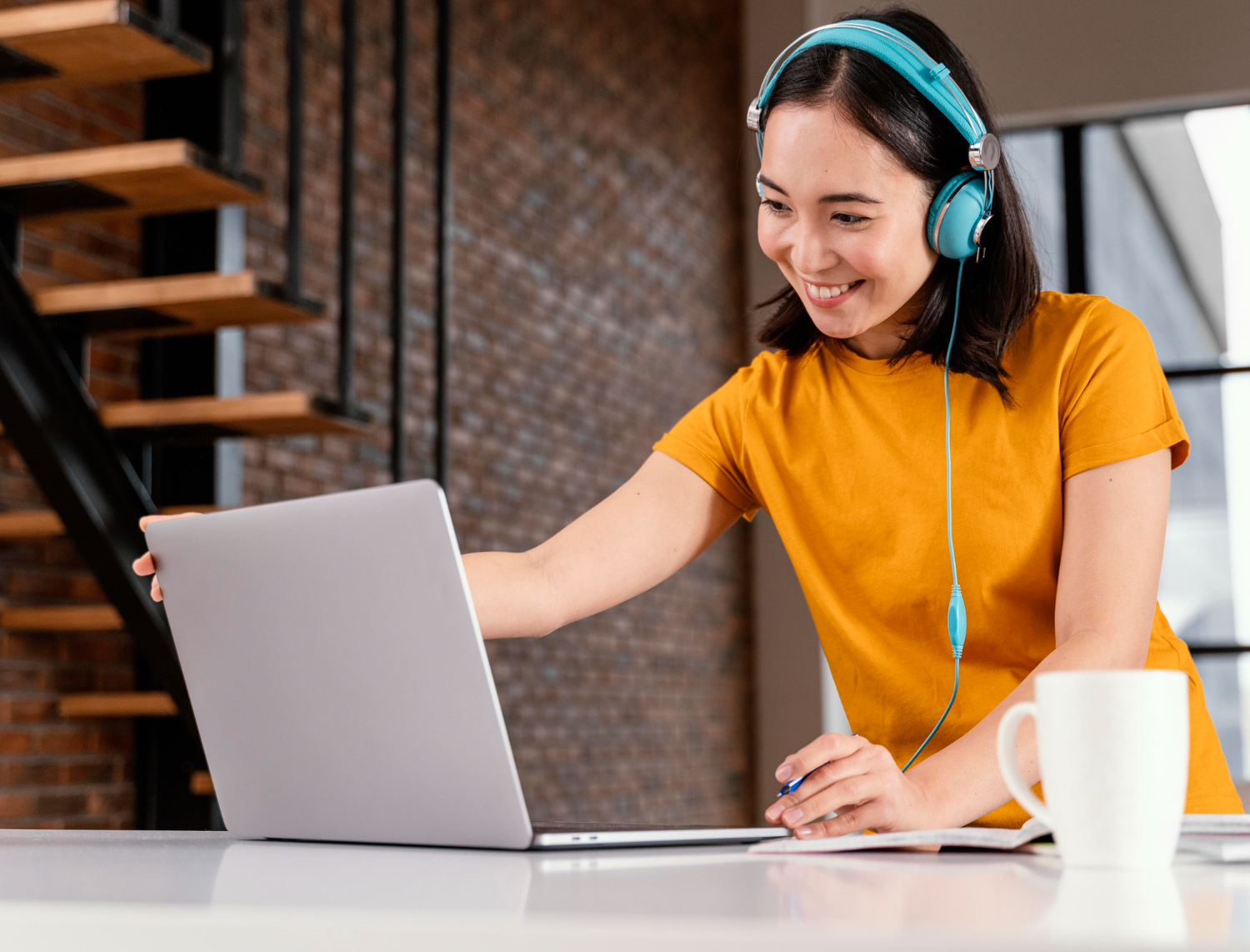 Medical Virtual Assistant working on a laptop in a healthcare setting.