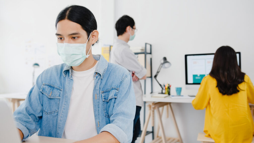 Medical Virtual Assistant working on a laptop in a healthcare setting.