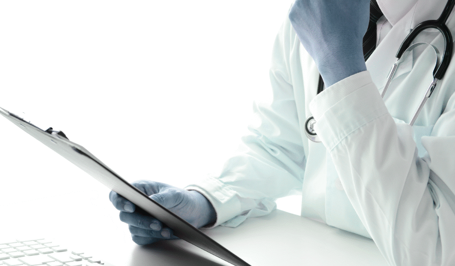 Doctor wearing a white coat and stethoscope, holding a clipboard