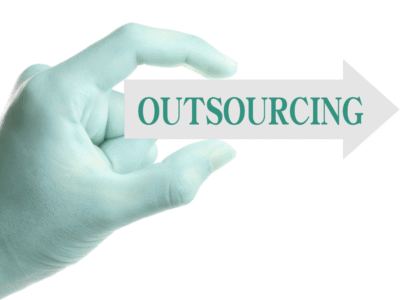 hand holding outsourcing sign