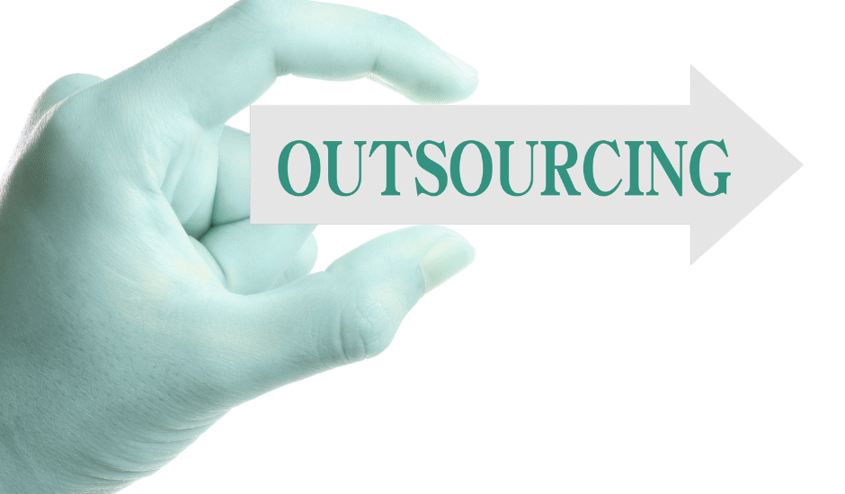 hand holding outsourcing sign
